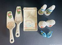 All items laid out including two pie servers, spoon rest and three salt & pepper sets