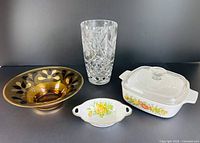 Group shot of amber bowl, crystal vase, porcelain bowl, Corning Ware casserole