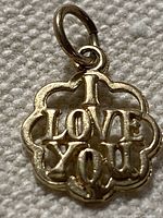 Front view showing raised "I LOVE YOU" text and quatrefoil frame