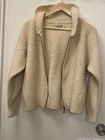 Front open view of cardigan on hanger