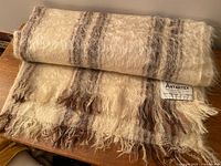 Labelled Antartex mohair wool scarf rolled showing texture and fringe