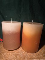 Front view of both unused Pier 1 pillar candles