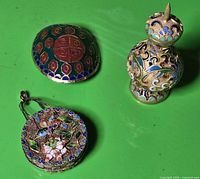 Group shot of jar, purse ornament and shield medallion