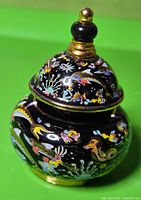 Full view showing colorful enamel sea life design on bottle body and lid