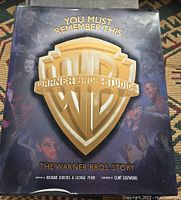 Front dust jacket of the book showing title and Warner Bros shield logo