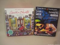 Front view of both puzzle boxes