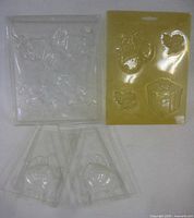 All three molds displayed: Pooh sheet, holiday sheet, two swan halves