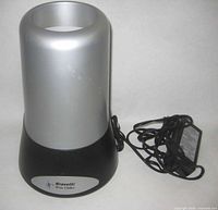 Front view of Bravetti wine chiller showing silver upper body and black base with logo