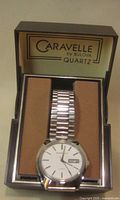 Watch in open Caravelle box displaying bracelet and dial