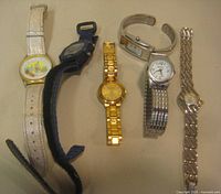 Group shot of all six watches laid flat