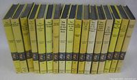 Spine view of 17 yellow-spine Nancy Drew books