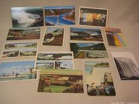 Fronts of 15 Niagara Falls postcards laid out