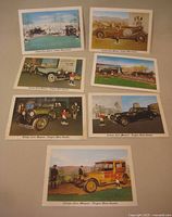 Fronts of seven postcards laid out