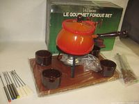 Full set with box: pot on stand, tray, four cups, eight forks