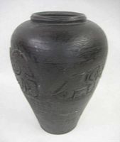 Full view of dark pottery vase