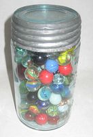 Jar full of marbles, front view