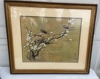 Framed lithograph with birds on cherry blossom branch
