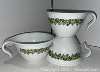 Three Corelle Spring Blossom Green hook handle coffee cups front and side view