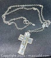 Full view of silvertone chain necklace with crystal cross pendant