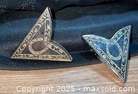 front view of both collar tips showing scrollwork and horseshoe motif