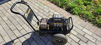 Full view of Mi-T-M electric power washer on brick surface