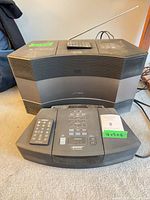 Both Bose units side-by-side with remotes visible