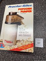 Front of boxed Proctor-Silex Popcorn Pumper