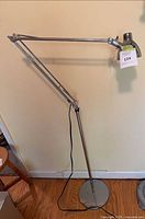 Full side view showing articulated arm and base