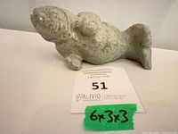 Front view of soapstone seal carving with size note visible