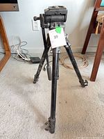 Full view of tripod standing with head attached