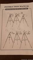 Instruction manual cover showing diagrams of refractor/reflector telescopes with alt-azimuth mount
