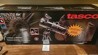 Retail box front showing Tasco branding and telescope image