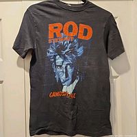 Full front view of 1984 Rod Stewart Camouflage Tour T-shirt on hanger