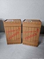 Two boxed A Christmas Story sock sets styled as wooden crates