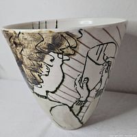 Side view showing etched figure and conical shape