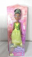 Front view of sealed Princess Tiana doll in original packaging