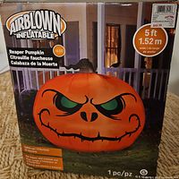 Box front showing Gemmy Airblown Inflatable Reaper Pumpkin, size and LED feature