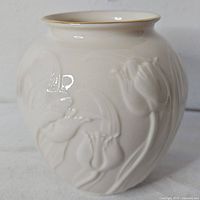 Full view of Lenox ivory china vase showing tulip relief and gold rim