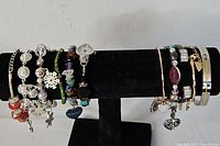Overview of all bracelets on black stand