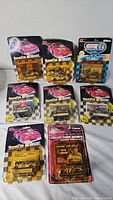Front view of nine sealed Racing Champions NASCAR cars on cards