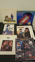 Eight LPs including Journey Escape, Billy Squier Don’t Say No, U2 October, Spirit album, The Who Who Are You, unidentified cartoon-cover record