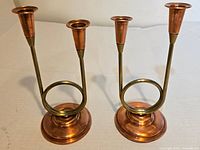 pair of copper and brass candle holders, full view