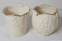 Pair of Lenox Merry Lights ivory china votive holders, gold trim