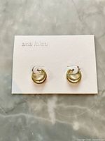 Front view of both Ana Luisa double hoop earrings on card backing