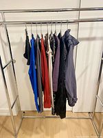 Nine Talula garments hanging on rack