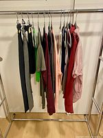Full rack view showing all 13 garments on hangers