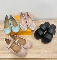 Four pairs of ASOS shoes displayed together