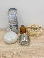 All five kitchen items grouped: garlic keeper, honey pot, butter dish, spaetzle maker, brie baker box