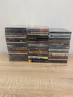 Front view of stacked jewel cases showing assortment of titles