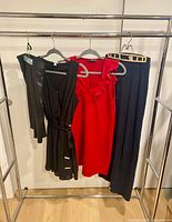 Group shot of all four garments on hangers